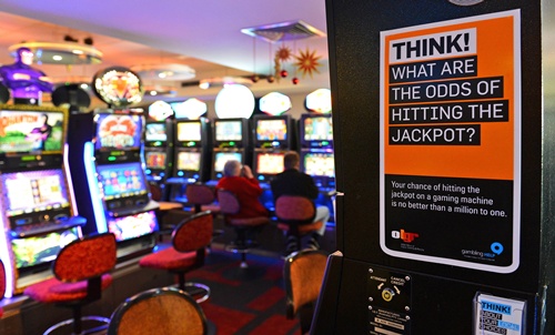 Australia gambles on move to tackle slot machine addicts